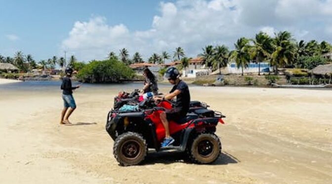 person riding an ATV in a scenic outdoor location